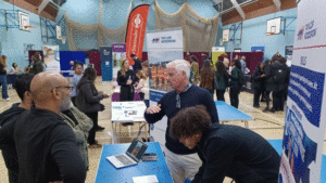 Selection of pictures from the event showing parents and studenst talking to buisiness and college representatives at stands, and taking part in workshops. 