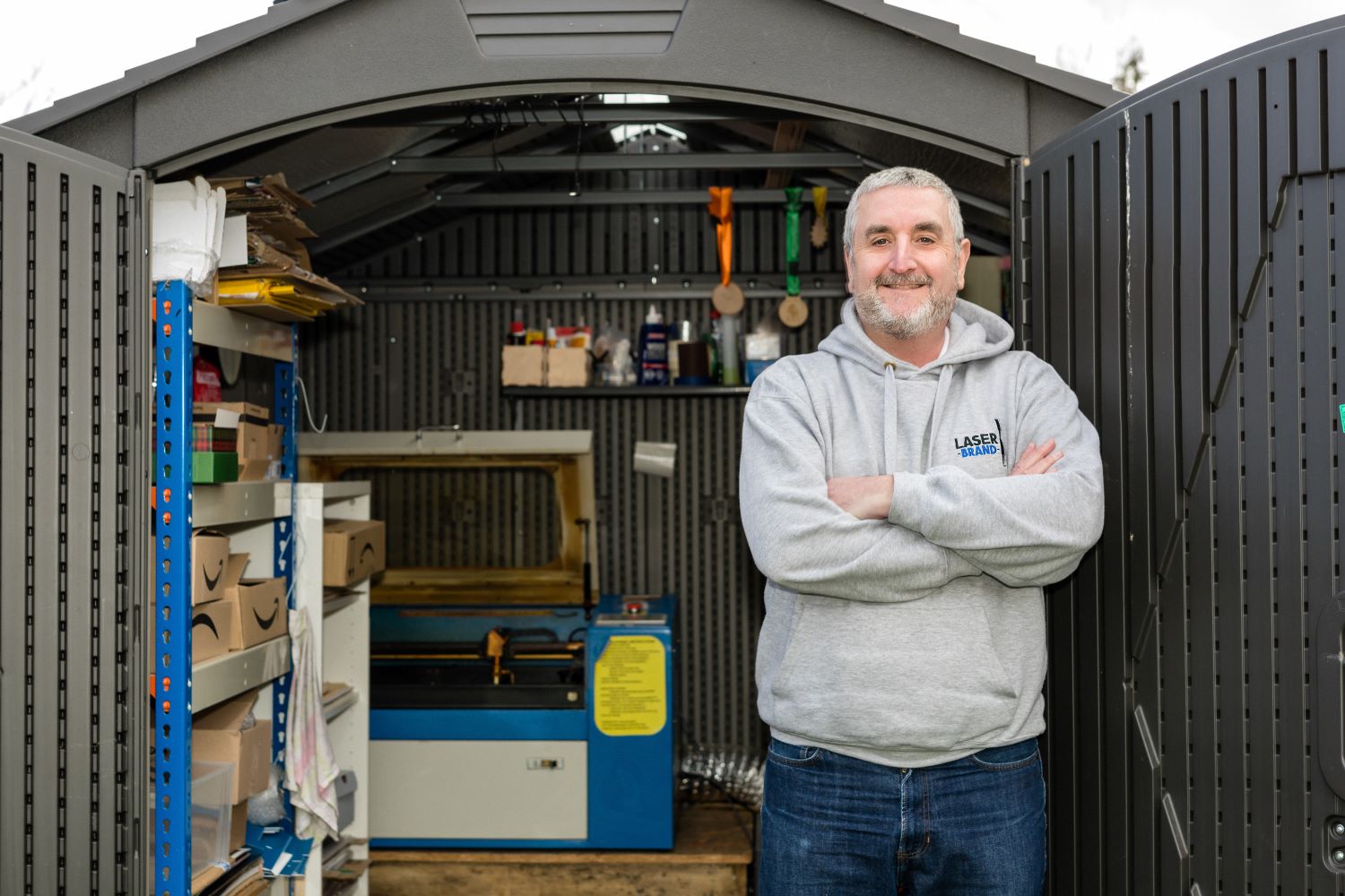 008-SEE - Laser Brand- Simon Fennel Decorative: Simon Fennel of Lazer Brand, helped by the E-Businesss Programme, standing outside his workshop.