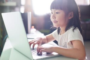 Decorative: young girl using laptop