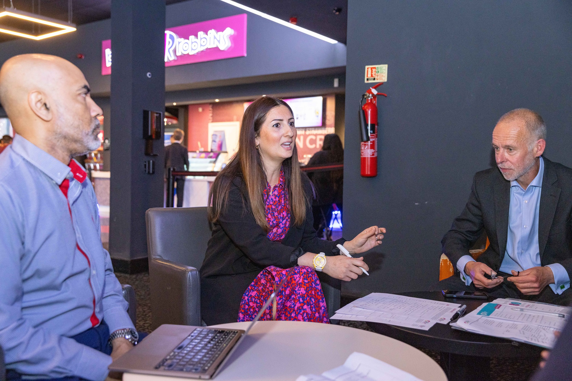 Forough Rahmani and other dragons discussing presentations