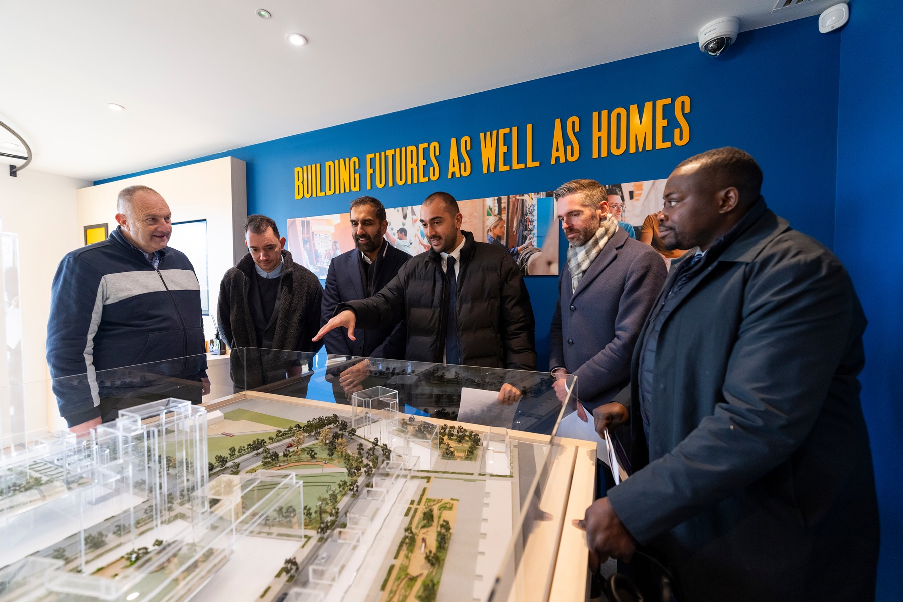 Cllr Erbil, Leader of Enfield shows local Leaders and Tom Copley, Deputy Mayor, a model of Meridian Water