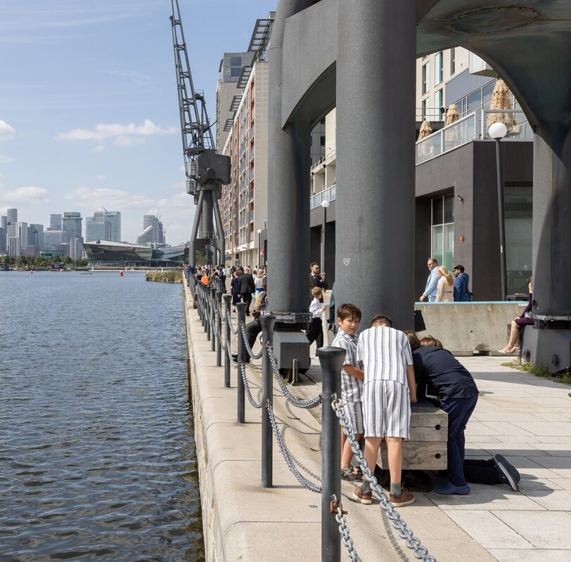 Sunny day at Newham Docks looking westwards towards the O2 and City Hall.