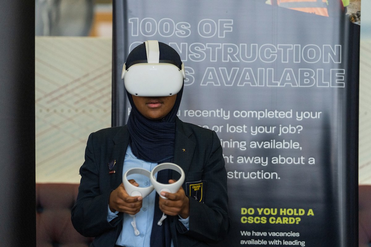 Climate Kick-Start Event East London 17 Nov (40) Girl wearing VR in from to construction jobs banner