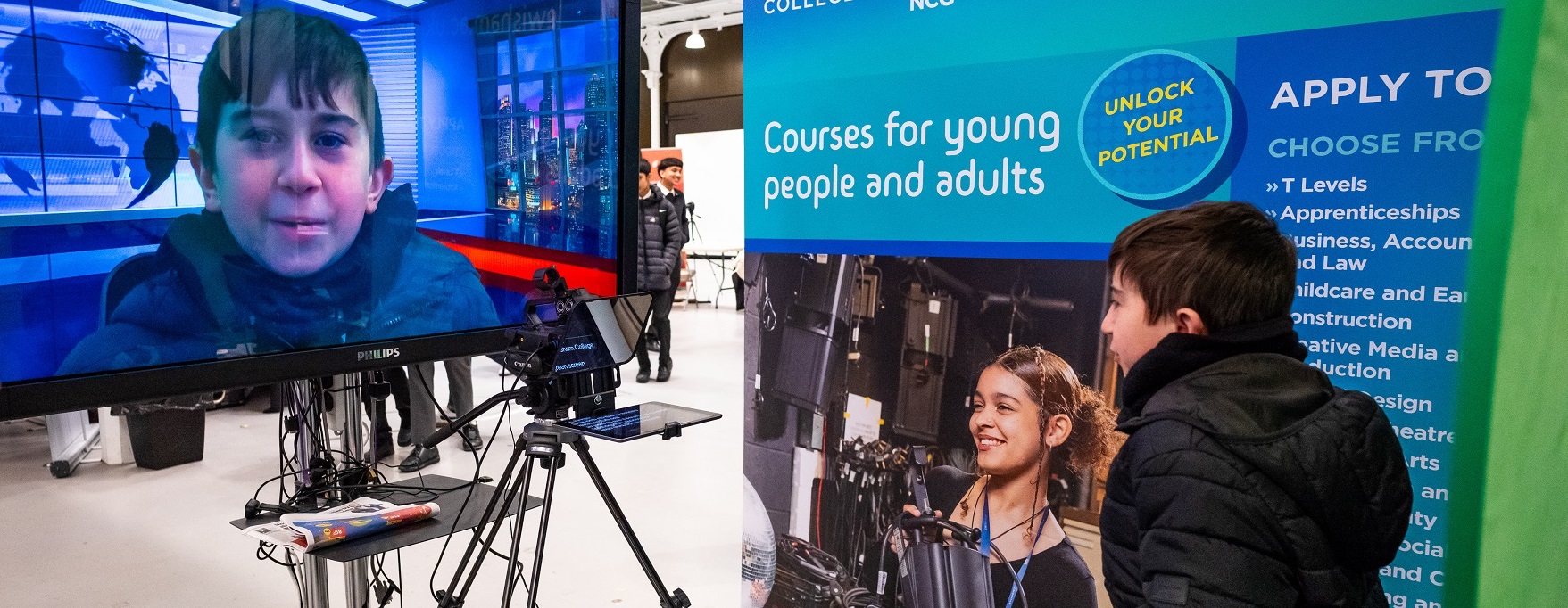07Mar24_CreditUpstartProductions_LewishamCollege_2000x1300crop Student trying out teleprompter and green screen at our creative and digital careers fair 2024.