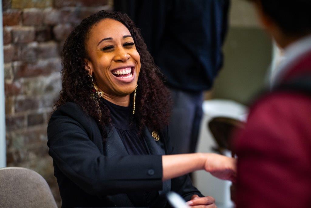 Adult smiling at one of our careers fairs for young people