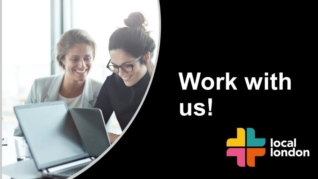 Work with us banner featuring two people happily looking at a computer.